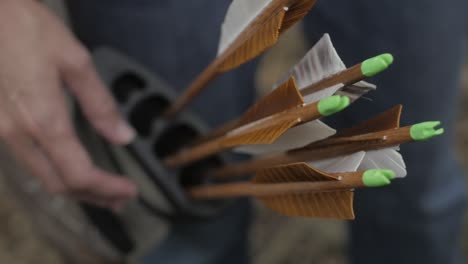 A-lady-archer-pulls-her-arrow-from-her-quiver,-readying-for-her-shot