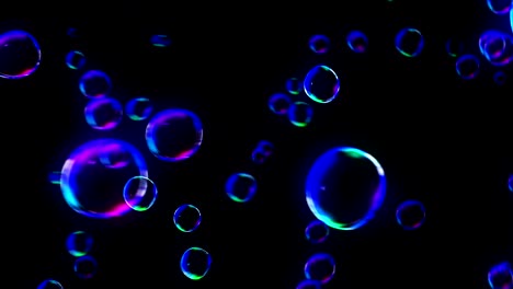 rainbow bubbles on a dark background, loop,