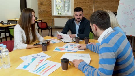 business team meeting involved diverse people participating in creative sustainable ideas steadicam shot across boardroom table shared work space