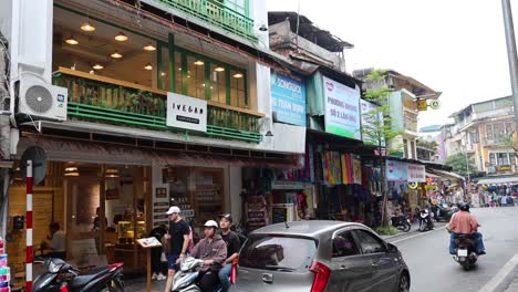 motorbikes and pedestrians in bustling street