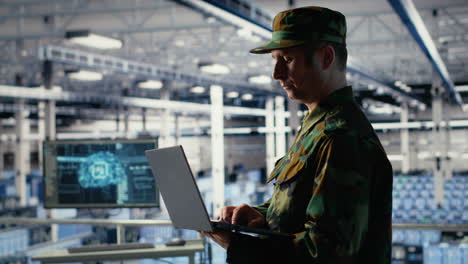 army soldier in server farm uses artificial intelligence program on laptop