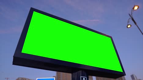 green screen billboard on urban, city life. blank advertisement panel, banner for marketing. chroma key empty sign.