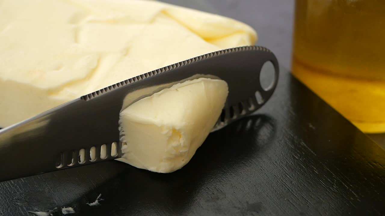 Butter being cut with a knife