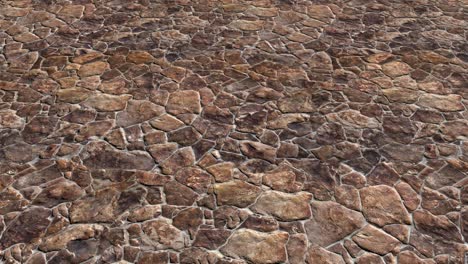 an aerial view over red and brown colored natural paving stone flags - seamless looping