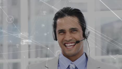 Animation-of-network-of-connections-over-businessman-using-phone-headsets