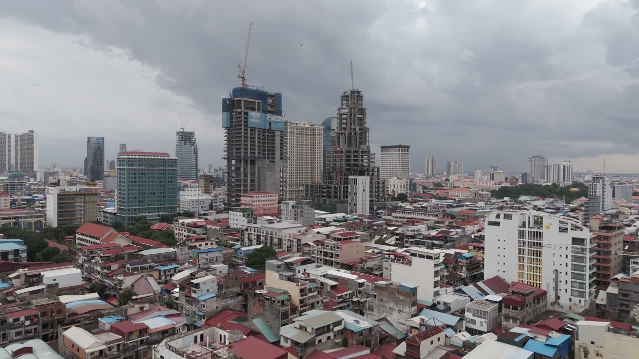 Aerial footage in Phnom Penh city center, Cambodia. Camera makes a circle above the old quarter from left to right