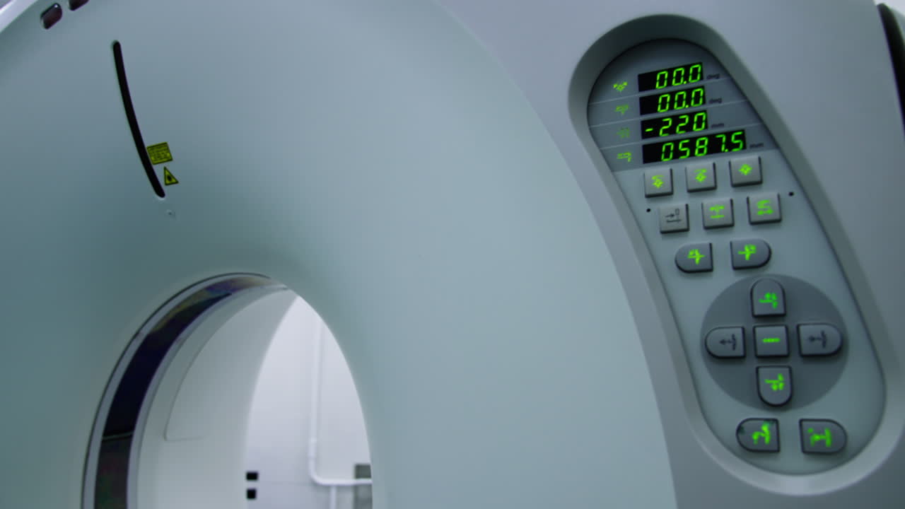 Keyboard panel at the modern technological equipment for magnetic resonance imaging. Switched on machine of computed tomography.