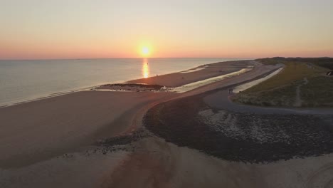 aerial: the beach between vlissingen and dishoek during sunset