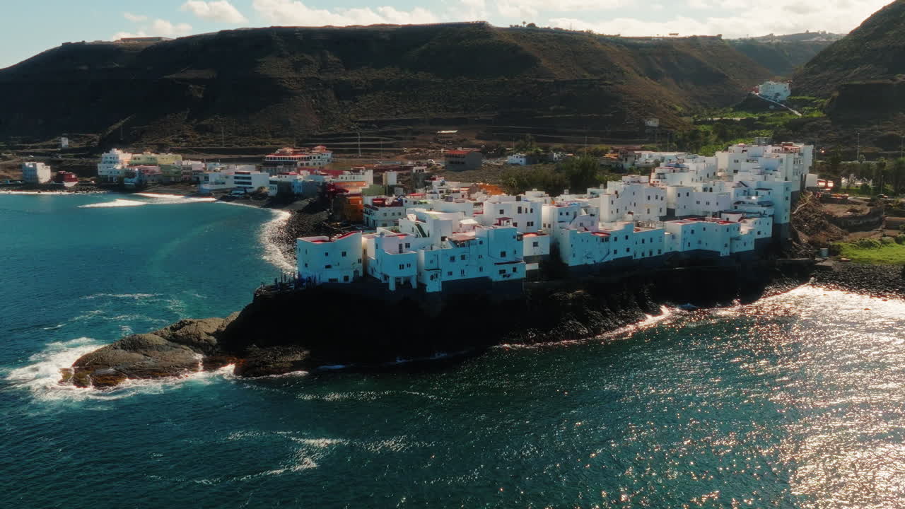 Pan shot of an almond town Tejeda among the mountains in the central highlands of Gran Canaria Spain. Drone view.
