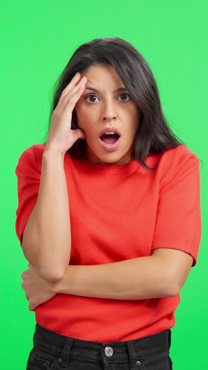 Young Woman Shows Shocked Reaction on Green Screen
