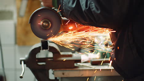 Angle-Grinder-Cutting-Metal-At-Workshop-10