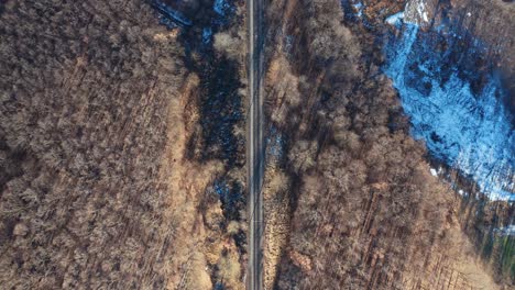 railroad in winter landscape. top aerial view of railroad and winter landscape with trees