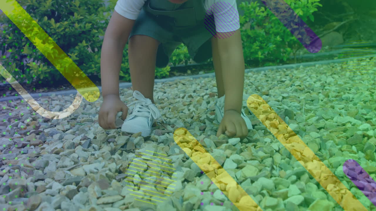 niño jugando con guijarros, formas coloridas y puntos de animación sobre la escena