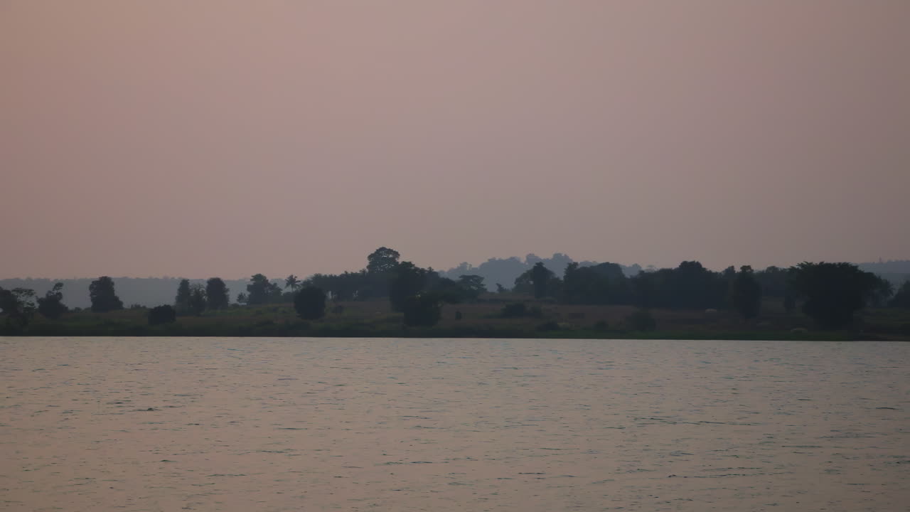 Evening calm over forest resort view across Kabini River in Nagarahole at sunset