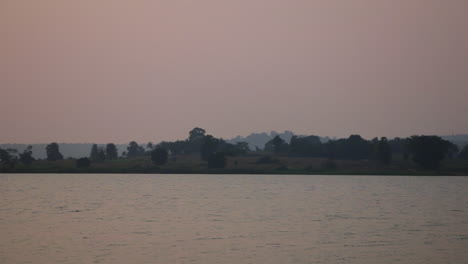 evening calm over forest resort view across kabini river in nagarahole at sunset