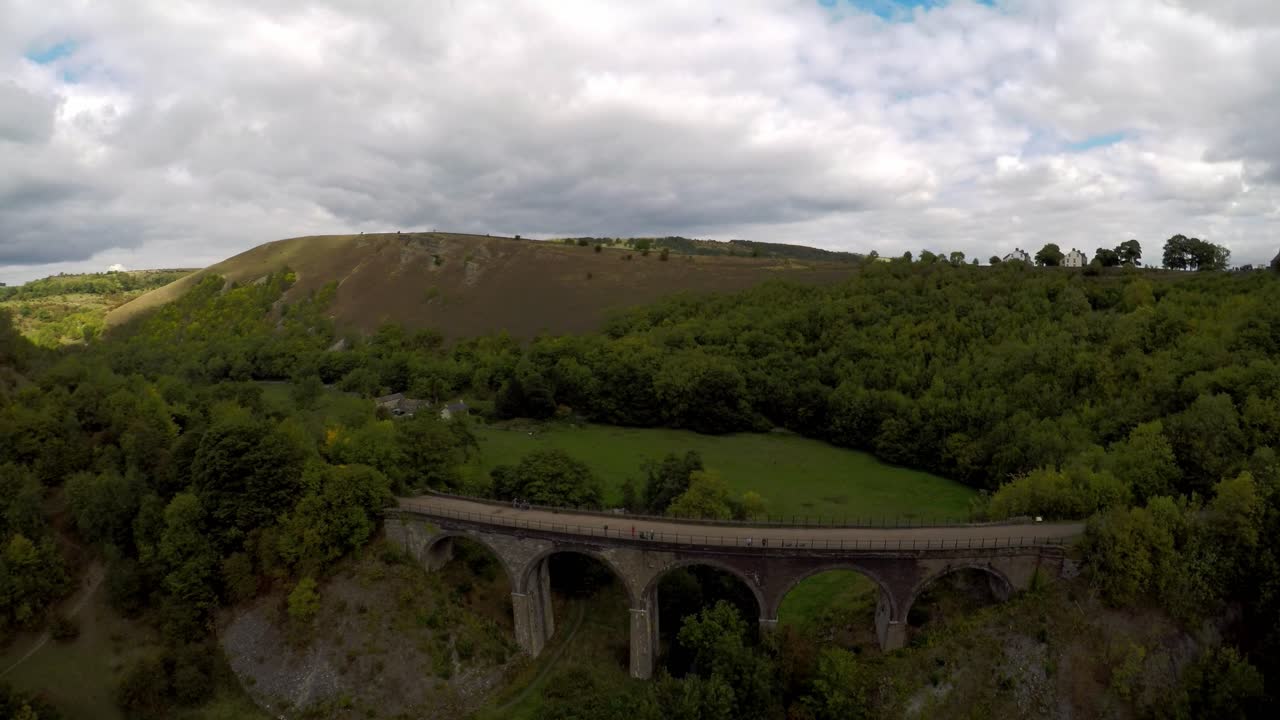 Aerial ascending view of Headstone viaduct, bridge in the Derbyshire Peak District National Park, Bakewell, commonly used by cyclists, hikers and popular with tourists and holiday makers