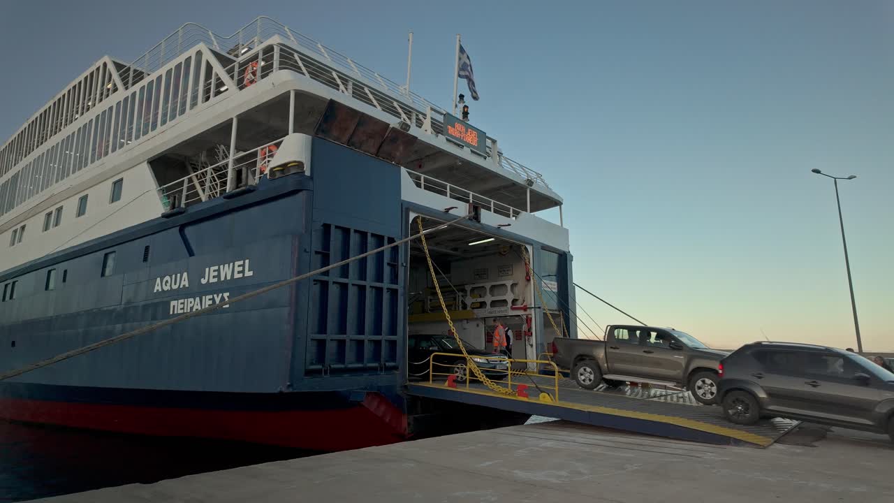 Vehicles disembark Greek car ferry docked Pelopennese port