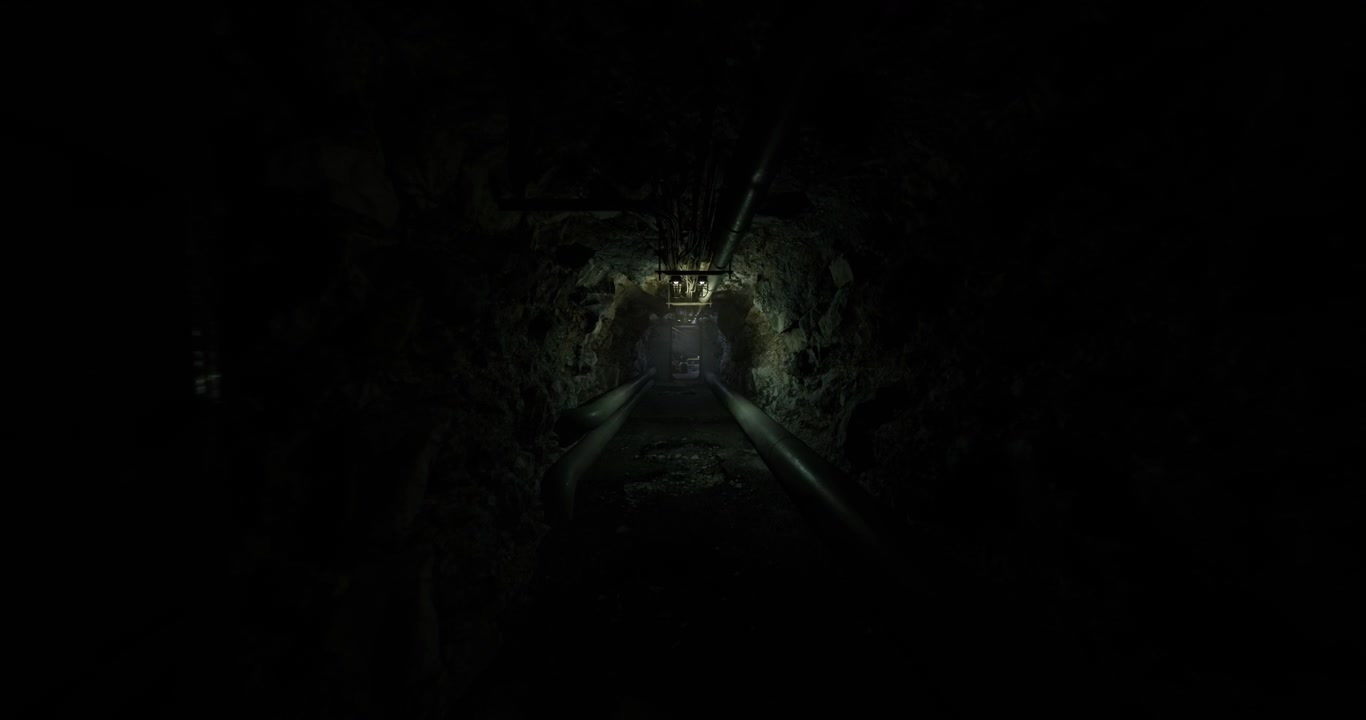 Secluded subterranean tunnel exhibiting reflections of light and eerie silence
