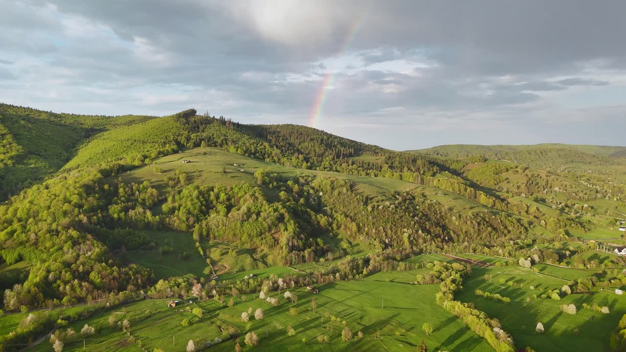 Drone view of hills between Poiana Micului and Manastirea Humorului at sunset