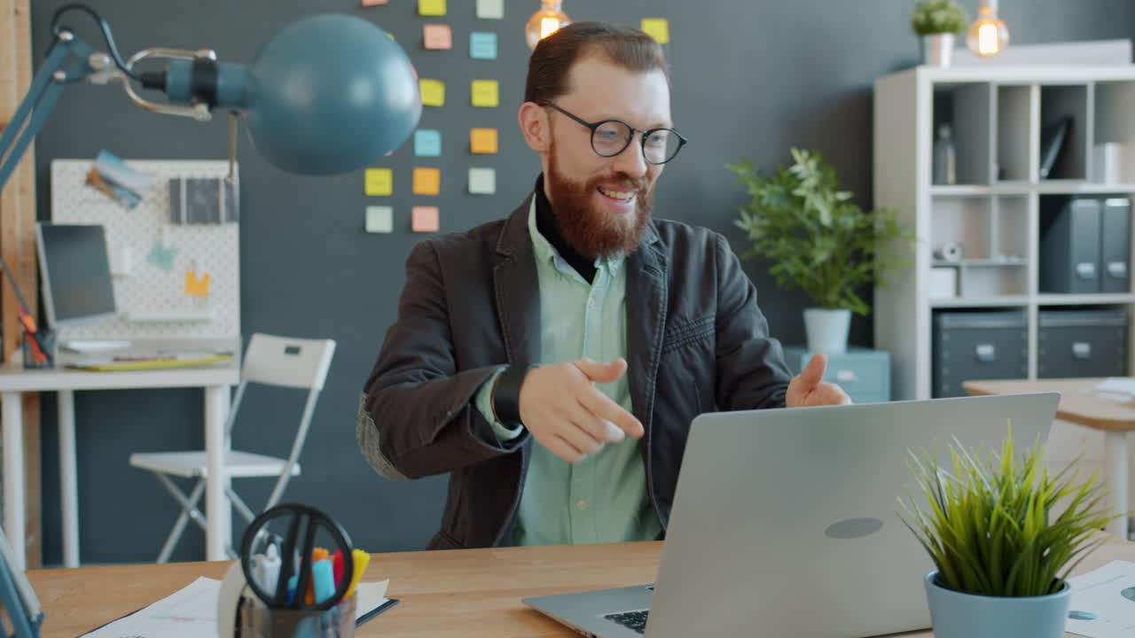 Businessman working on laptop in modern office