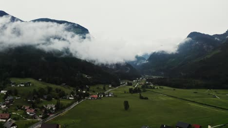 misty mountain valley with village