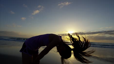 ethnic asian chinese female on beach in sportswear