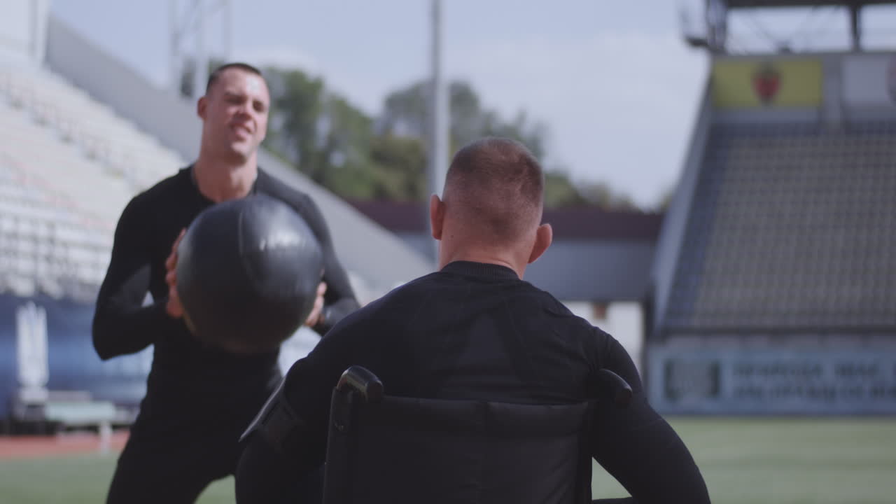 Athlete in Wheelchair Training with a Partner