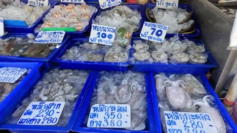 various seafood on ice with price tags