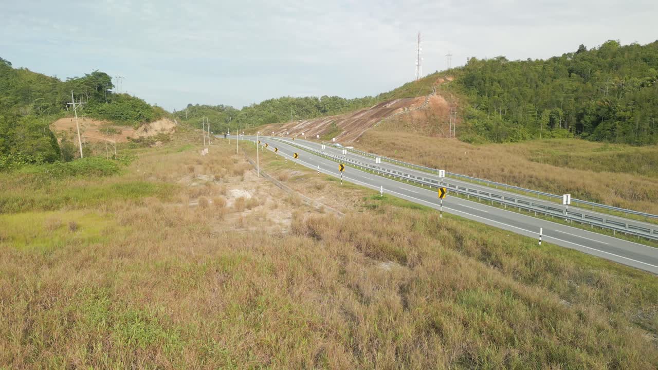 Beautiful Drone View Of Bau To Lundu Pan Borneo Highway During Morning Sunset With Mountain And Valley, Green Forest,Sarawak, Borneo.