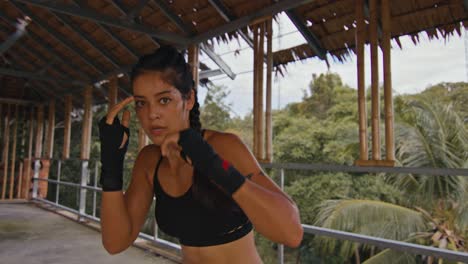female fighter training outdoors