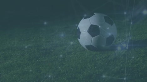 animación de la red de conexiones sobre el jugador de fútbol con el fútbol en el campo.