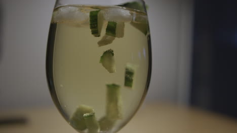 Chunks-of-cucumber-slowly-rise-to-the-top-of-a-glass-of-sangria