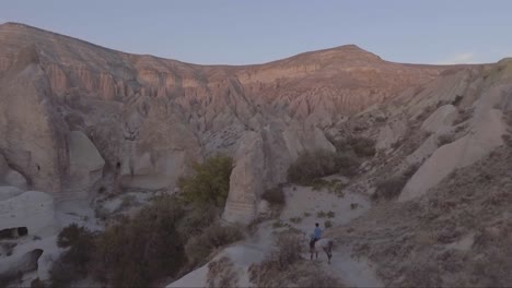 Aerial-of-tourists-riding-horses-horseback-riding-at-Cappadocia-Turkey-3