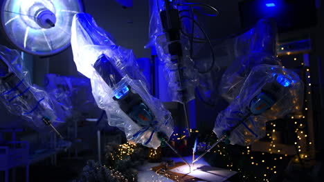 futuristic robot covered with plastic in dark modern surgery room. technologically precise equipment writing on paper with a writing pen. garlands at the table.