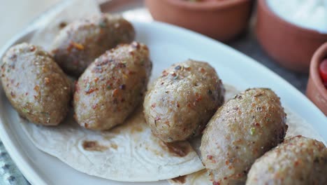 turkish meatballs served with flatbread, yogurt and tomato salad