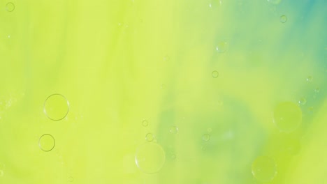 animation of bubbles moving on green liquid with copy space