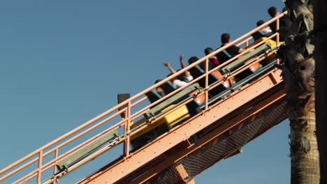 roller coaster going up track in the day time