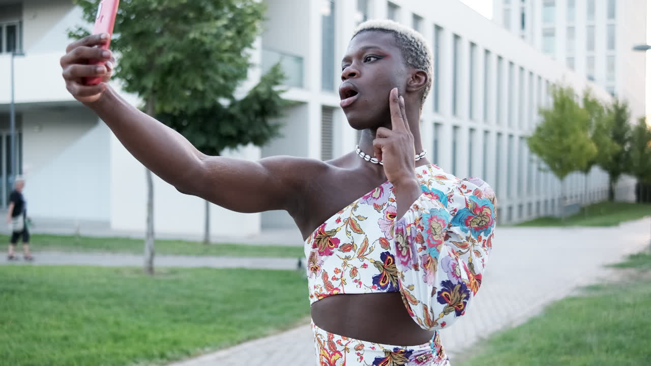A person taking selfies in a floral dress