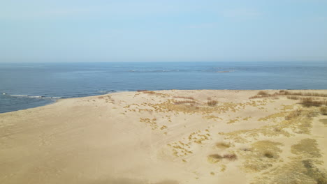 sandy beachfront on sobieszewo island over bay of gdansk in the baltic sea, poland