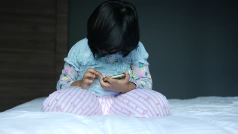 child girl watching cartoon on smart phone ,