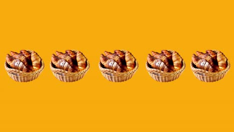 animación de bucle sin fisuras con pasteles frescos y croissants franceses cubiertos de azúcar en polvo en una canasta rústica. una línea o fila de alimentos movimiento gracioso en un fondo amarillo con espacio de copia
