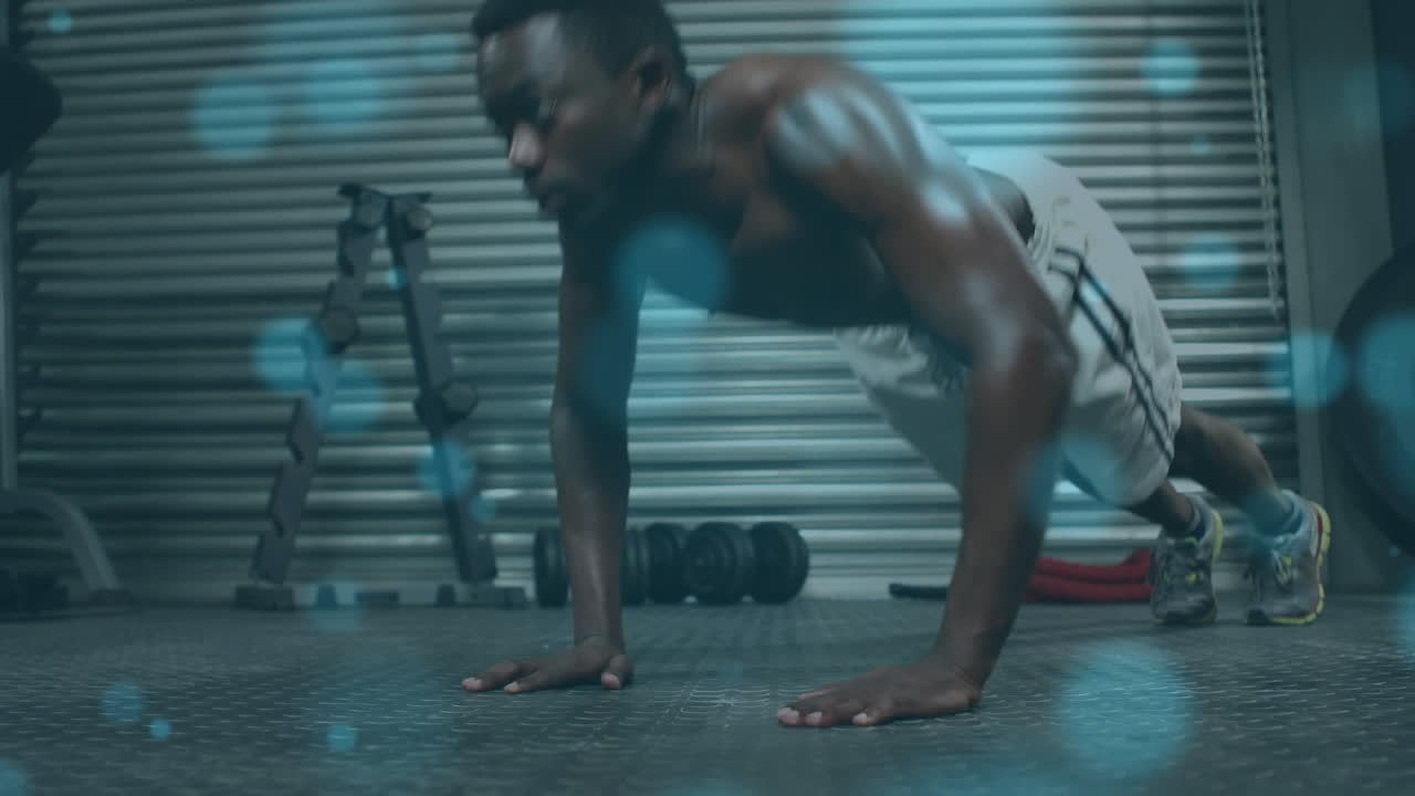 animación de luz brillante sobre un hombre en forma haciendo ejercicio en el gimnasio