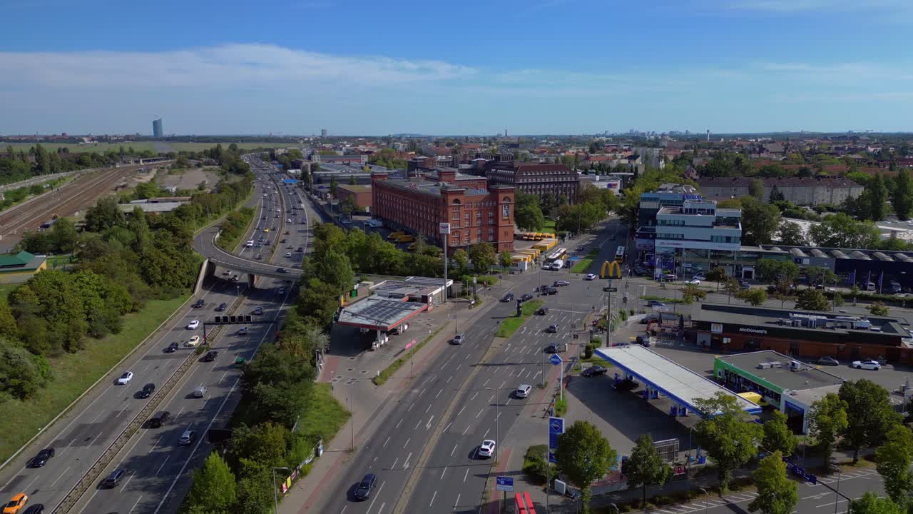 cars navigating a busy Berlin intersection with clear road markings. Magic aerial view flight panorama overview drone