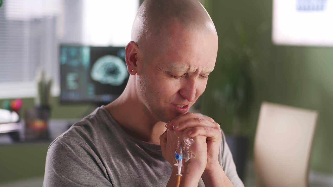 Man Praying During Cancer Treatment
