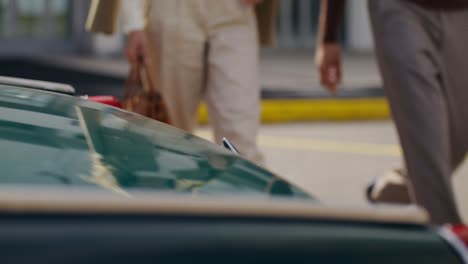 couple walking by a car