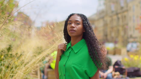 Female-Tourist-On-Vacation-In-Oxford-UK-Exploring-City-Walking-Along-Broad-Street-1