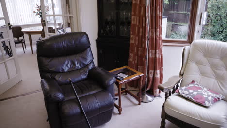 a living room with an armchair and other furniture