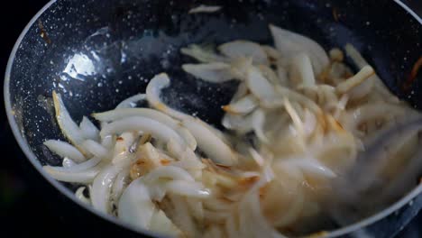 cooking onions in a pan