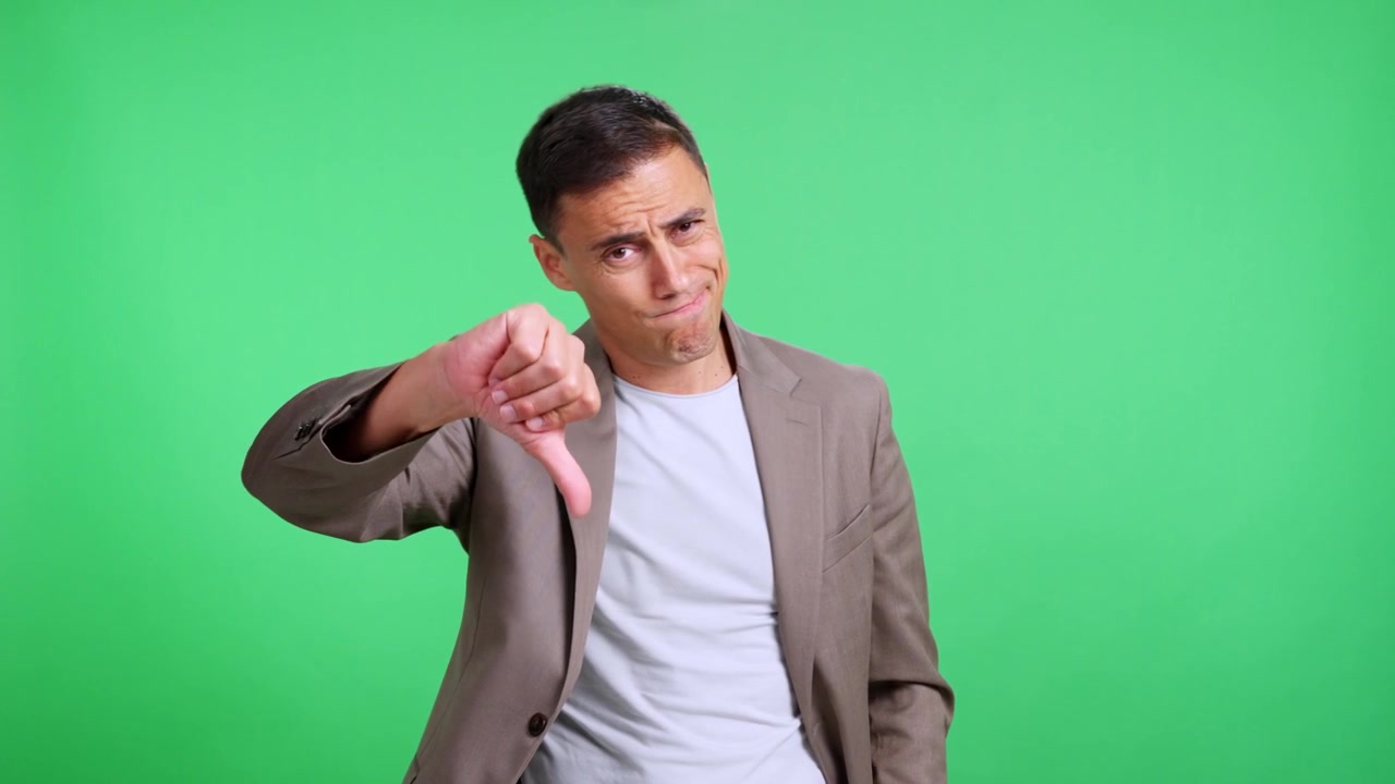 Unhappy businessman showing thumb down gesture