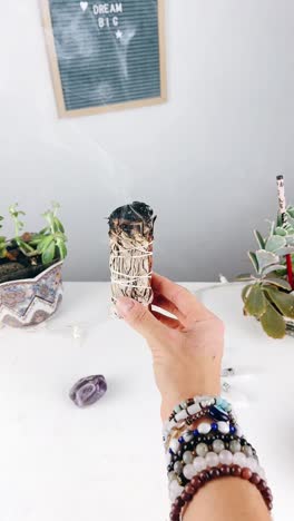 smudging with white sage and crystals